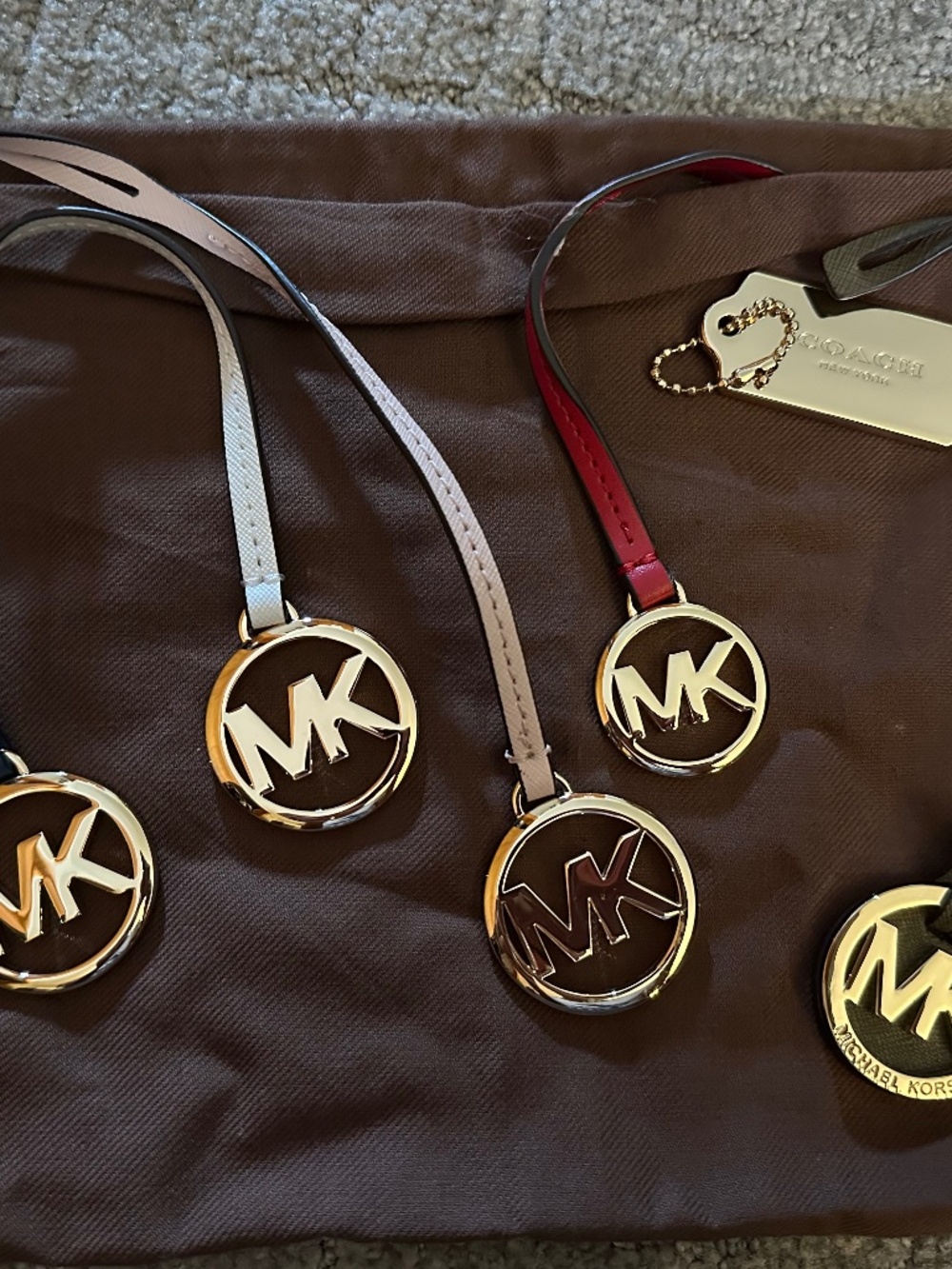 Variety of MK & Coach handtags